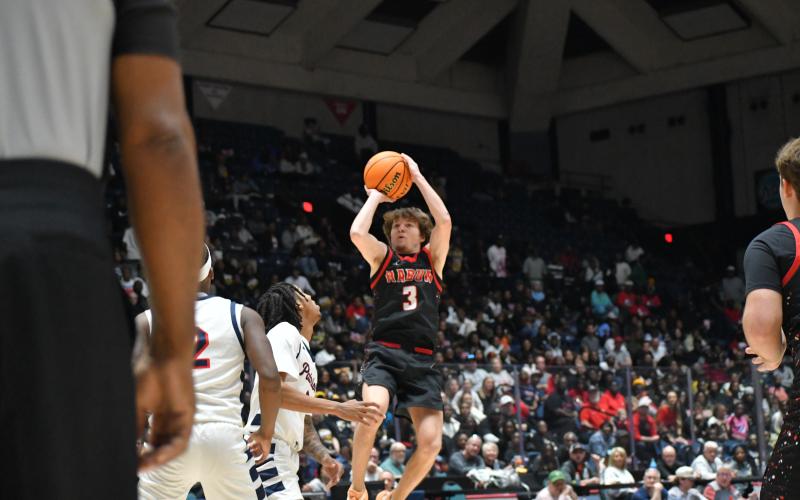 Wesley Branch/The Clayton Tribune. Wildcat senior Huey Blalock, a Navy basketball commit, elevates for his shot against Southwest in the state title game on March 13 in the Macon Coliseum. Blalock was the game’s leading scorer with 29.