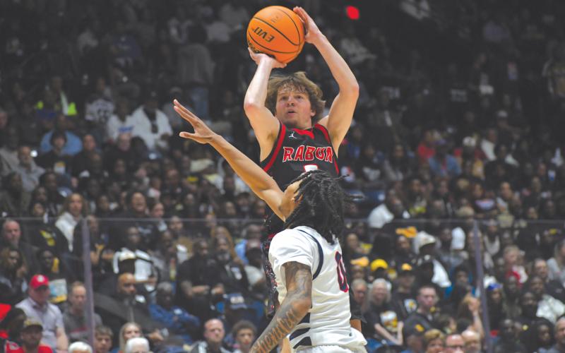Wesley Branch/The Clayton Tribune. Rabun County senior Huey Blalock rises for a jumper over Southwest’s Chase Dupree during Rabun County’s 52-43 state championship win on March 13 at the Macon Coliseum. Blalock finished the game with 29 points, six rebounds and five assists, earning MVP honors for the game.