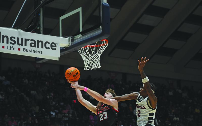 Wesley Branch/The Clayton Tribune. Rabun County senior Hayes Free fights through contact from a Southwest defender for a layup in Rabun County’s 52-43 state championship victory over Southwest at the Macon Coliseum on March 13. Free finished the game with 12 points and eight rebounds.