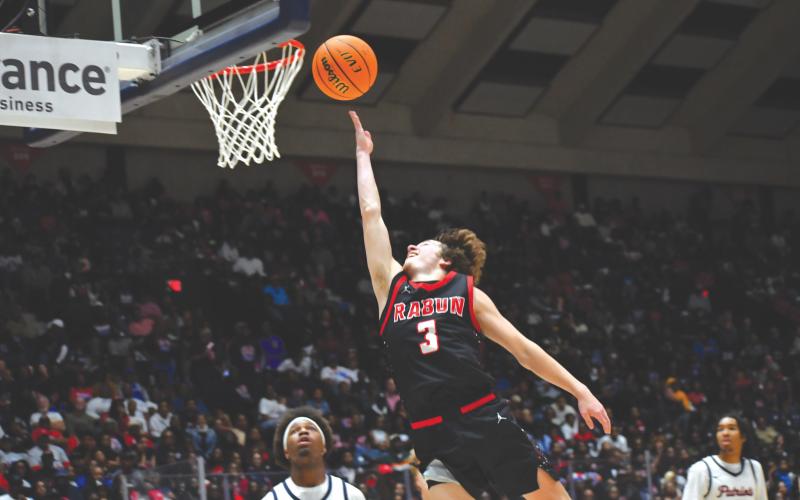 Wesley Branch/The Clayton Tribune. Rabun County senior Huey Blalock lays the ball in during Rabun County’s 52-43 state championship win over Southwest on March 13 at the Macon Coliseum. Blalock finishes his career at RCHS with the championship and MVP honors from the game on top of his already impressive resume.