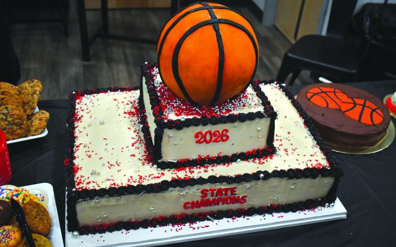 Wesley Branch/The Clayton Tribune. The Rusty Baker made a cake for the event, provided by the RCHS Athletic Booster Club to celebrate the state championship team at Wildcat Grill on March 19.