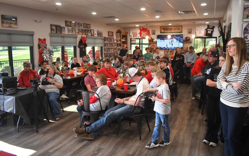 Wesley Branch/The Clayton Tribune. The community packed the Wildcat Grill March 19 for the chance to personally congratulate the RCHS boys basketball team on winning the state title. The event was broadcast live on Wildcat Sports LIVE.