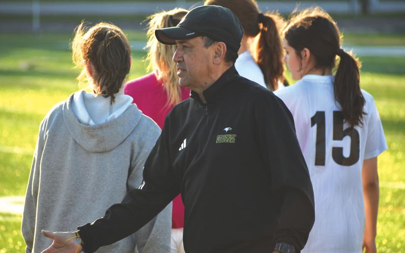 Wesley Branch/The Clayton Tribune. Rabun Gap Director of Soccer and girls head soccer coach JC Gonzalez shakes hands with Asheville High School players after the Eagles’ 3-0 loss to the Cougars on March 23. Gonzalez is in his first year as the director of soccer and first season as the RGNS girls head coach.