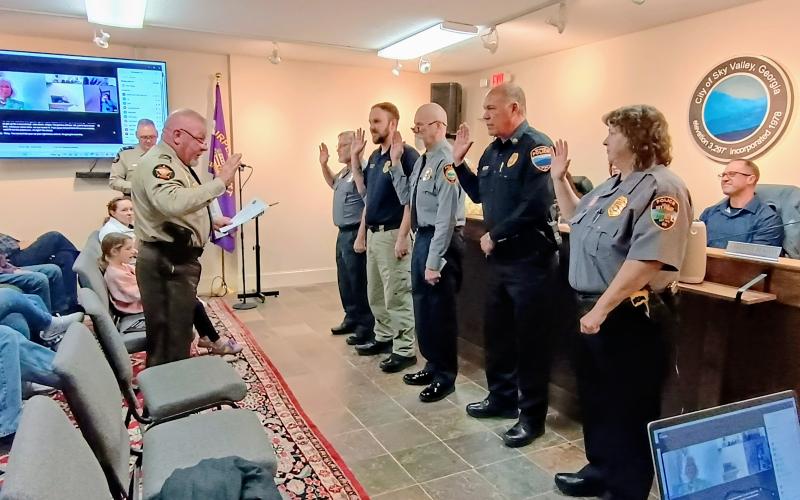 Megan Horn/The Clayton Tribune. Sky Valley Police Department officers are sworn-in as deputies with the Rabun County Sheriff’s Office during the March 17 city council meeting at Sky Valley City Hall. The partnership allows Sky Valley Police officers to assist the sheriff’s office whenever needed.