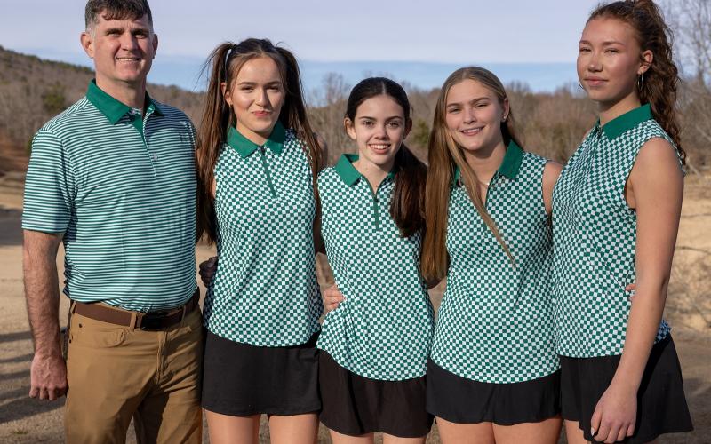 TFS Athletics. Standing with coach Brian Velazquez are girls golf team members Alex Rokosler, Maeve Hatcher, Handley James and Kathi Ishaque.