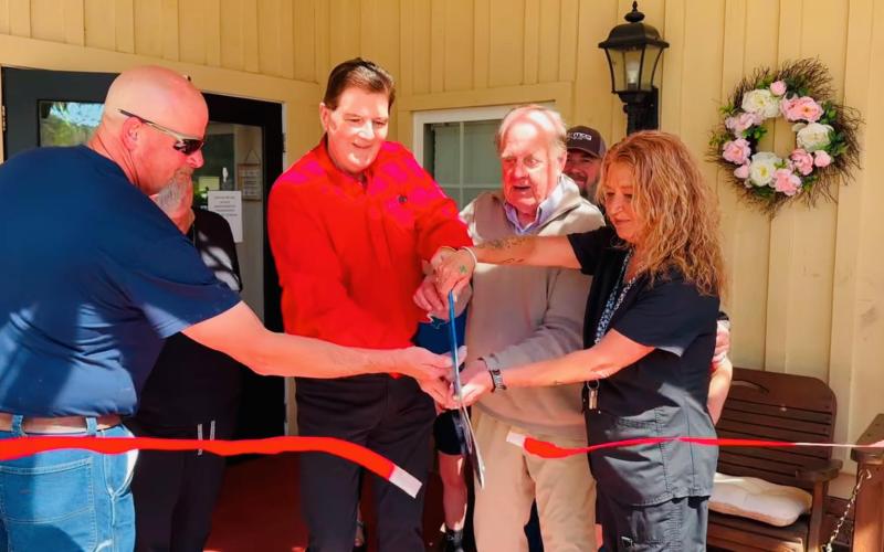 Photo courtesy of Forward Rabun/Rabun County Chamber of Commerce.  Community members and the Majors celebrate the 20th anniversary on Cannonwood Retirement Home in Tiger. The Majors also own the Tiger Drive-In which is next door to Cannonwood.