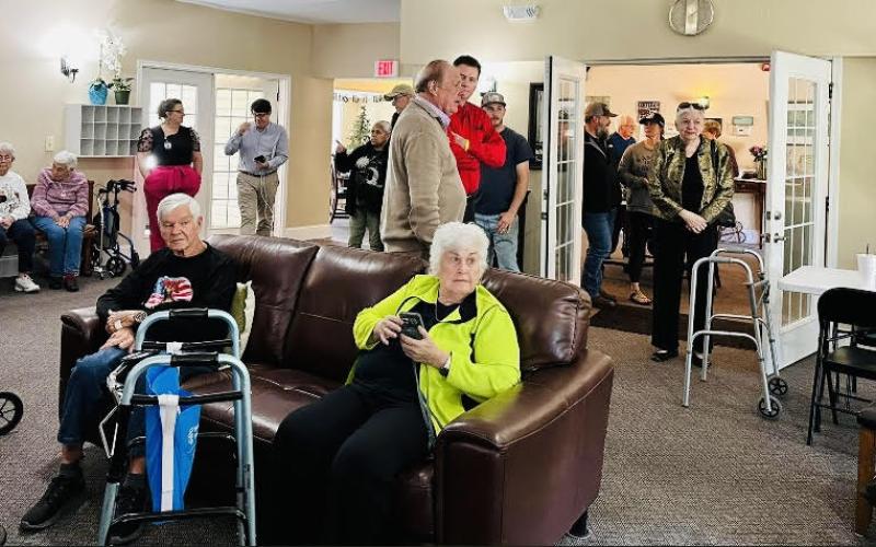 Photo courtesy of Forward Rabun/Rabun County Chamber of Commerce.  Community members and the Majors celebrate the 20th anniversary on Cannonwood Retirement Home in Tiger. The Majors also own the Tiger Drive-In which is next door to Cannonwood.
