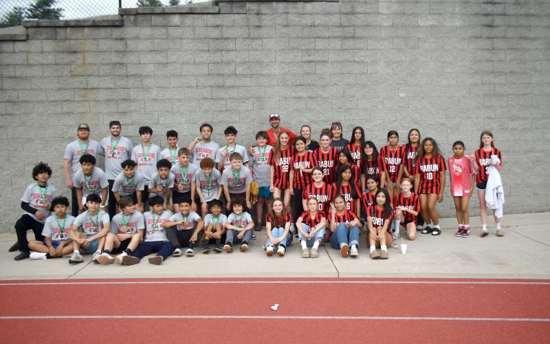 Wesley Branch/The Clayton Tribune. The Rabun County middle school soccer teams pose for a photo on “Rec Night” at Rabun County High School on March 31. The boys finished 14-0 and won the region title and the girls were the region runner-up.