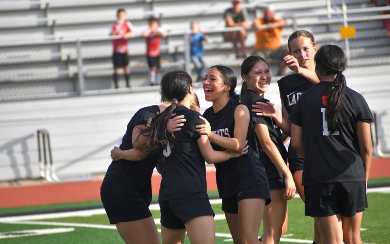 Wesley Branch/The Clayton Tribune. The RCHS girls soccer team celebrates a goal scored by Evelyn Rios in its 7-0 win over Banks County on March 31. The Lady Cats sit at 7-7 on the season and have won seven of their last eight games.