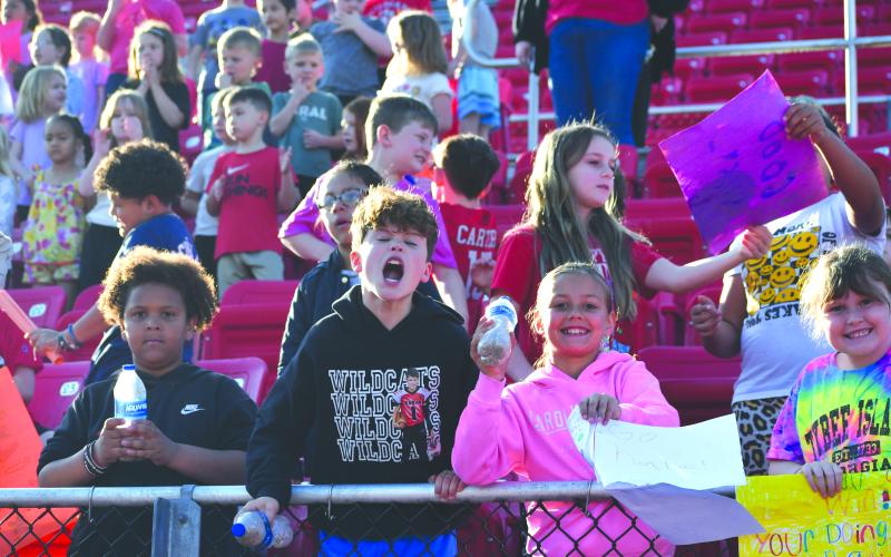 Wesley Branch/The Clayton Tribune. Other Rabun County School System students were in attendance on April 2 for the Rabun County Special Olympics. In the picture above, students can be seen smiling and cheering during the event’s opening ceremony.