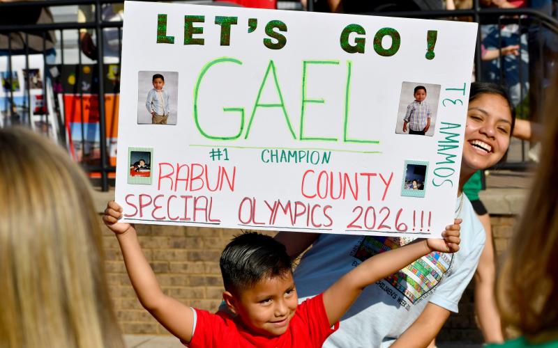 Wesley Branch/The Clayton Tribune. Rabun County Primary School athlete Gael Esteban poses with a sign that was made for him during the Rabun County Special Olympics on April 2 at Frank Snyder Memorial Stadium.