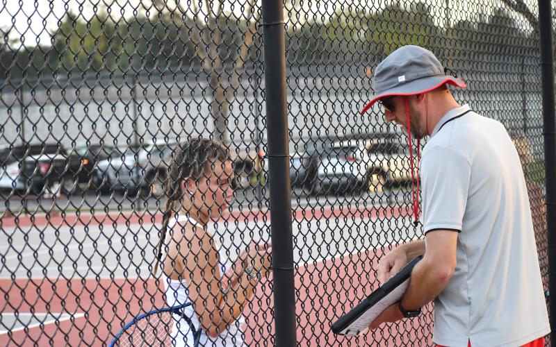 Wesley Branch/The Clayton Tribune. Rabun County head tennis coach Bryan Getty talks with Emma Krivsky. Two tennis camps for set for June.