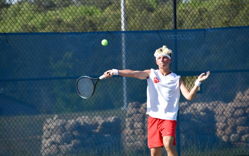 Wesley Branch/The Clayton Tribune. Rabun County junior Cobe Smith prepares to return the ball in his singles match on April 15 in the region tournament championship versus Athens Academy at Victory Lord Park in Winder, Ga. Smith finished the regular season with an undefeated 14-0 record.