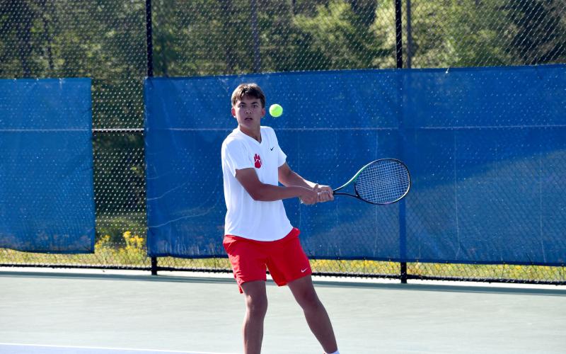 Wesley Branch/The Clayton Tribune. Rabun County’s Braylon Kelly returns an Athens Academy serve during Kelly and Andrew Conner’s doubles match on April 15 versus Athens Academy in the region tournament championship. Kelly and Conner’s match did not finish due to the Spartans claiming victory before the completion of the match.