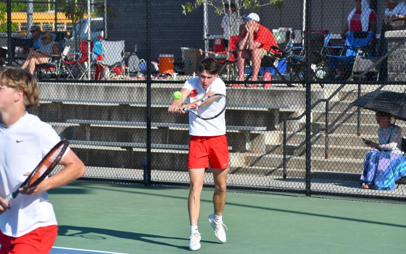 Wesley Branch/The Clayton Tribune. Rabun County senior Brady Darnell prepares to strike the ball in Darnell and Landan Bedingfield’s doubles match on April 15 at Victory Lord Park in Winder, Ga., in the region tournament championship versus Athens Academy. Darnell and Bedingfield defeated their opposing Spartan doubles team.