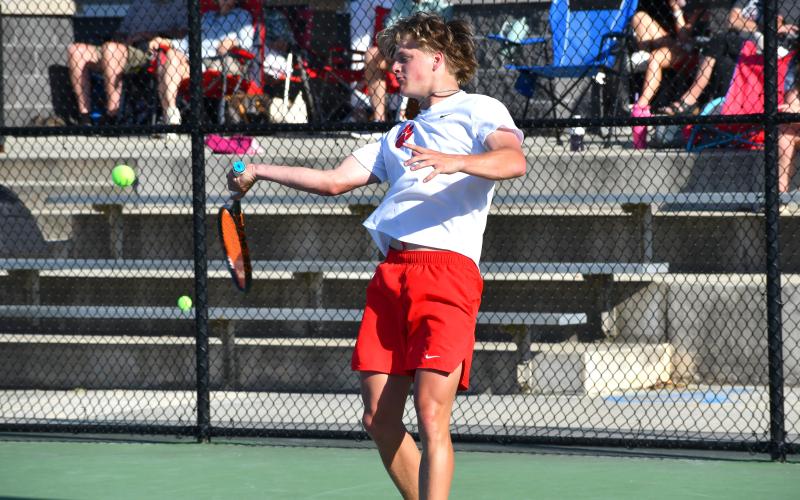 Wesley Branch/The Clayton Tribune. Rabun County junior Landan Bedingfield prepares to strike the ball in Bedingfield and Brady Darnell’s doubles match on April 15 at Victory Lord Park in Winder, Ga., in the region tournament championship versus Athens Academy. Bedingfield and Darnell defeated the Spartans’ duo of  Price West and Jack Roberts, who were undefeated going into the match.