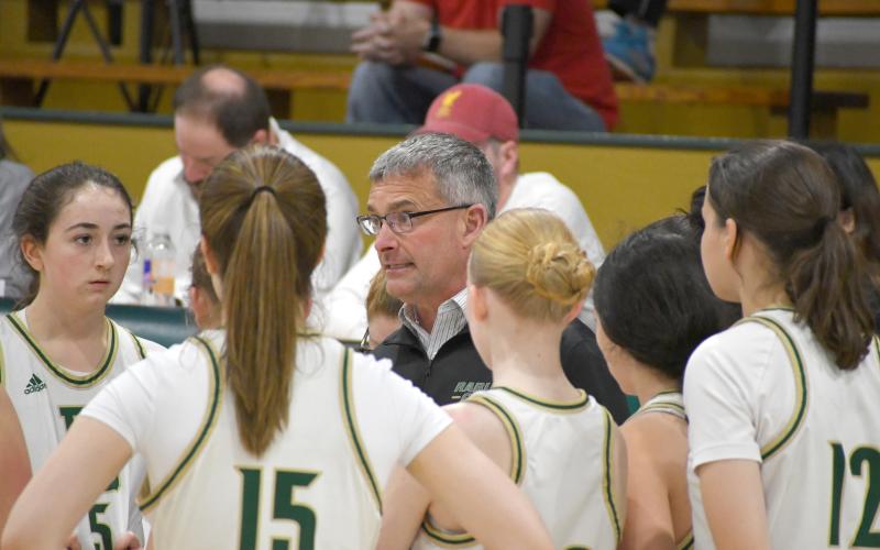Wesley Branch/The Clayton Tribune. Rabun Gap athletic director and girls head basketball coach Dale Earnhardt addresses his team during a timeout in Rabun Gap’s 59-27 win over Carolina Day on Jan. 8. Earnhardt is leaving Rabun Gap after 19 years at the school, 13 of which was spent as the athletic director.