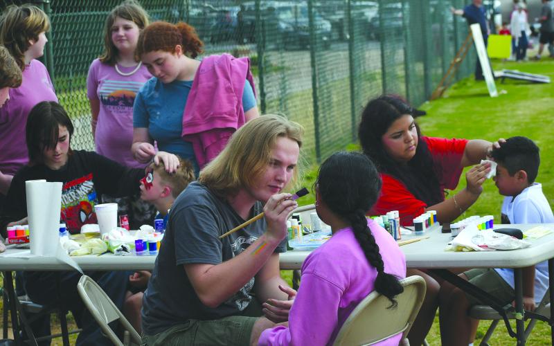 Enoch Autry/The Clayton Tribune. Several youth got in line to have their faces painted by skilled artists at the April 2 Egg Hunt at the Rabun County Recreation Department.