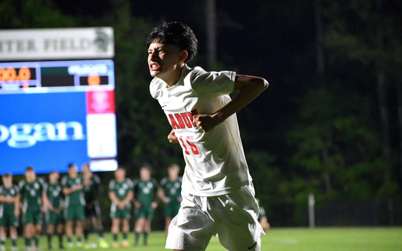 Wesley Branch/The Clayton Tribune. Rabun County sophomore Carlos Lopez-Justice celebrates after scoring his PK during the penalty shootout of Rabun County’s loss to Athens Academy on April 15 at Athens Academy. The loss marks the second consecutive year RCHS has finished as the runner-up in the region.