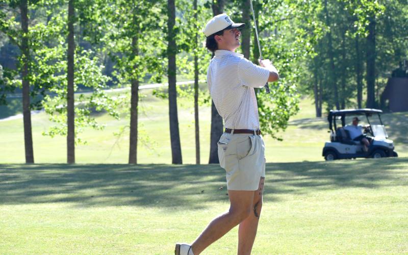 Wesley Branch/The Clayton Tribune. Rabun County senior Ty Truelove holds his follow through as he watches his shot during Rabun County’s golf match versus Union County on April 16 at Kingwood Resort. Truelove shot a season best 38 on the afternoon.