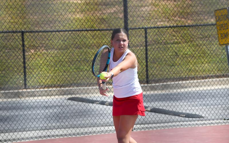 Wesley Branch/The Clayton Tribune. Rabun County’s Jewels Hutcheson prepares to serve during her and RCHS senior Caroline Marshall’s doubles match versus Dodge County.