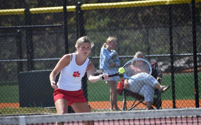 Wesley Branch/The Clayton Tribune. Rabun County’s Mia Potts loads up to strike the ball in her singles match against Dodge County on April 21 at Rabun County High School. Potts secured the match-clinching victory by winning her singles match on No. 2 singles.