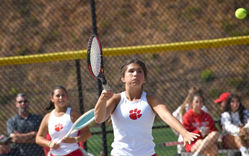 Wesley Branch/The Clayton Tribune. Rabun County’s Gracie Dunn sends the ball back over the net during her and Lady Cat Ella Weber’s win on No. 1 doubles versus Dodge County on April 21. Dunn and Weber were triumphant in two sets by scores of 6-1 and 6-1.