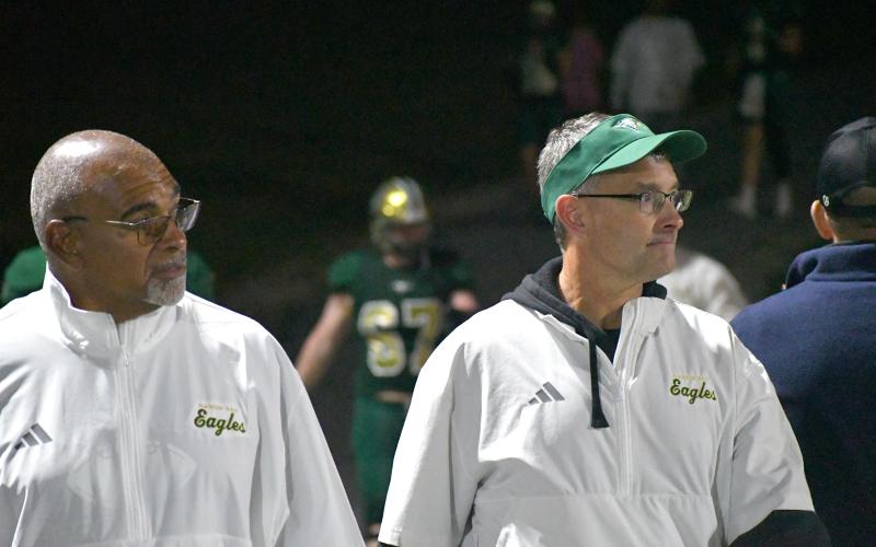 Wesley Branch/The Clayton Tribune. Rabun Gap athletic director, girls basketball coach and defensive backs coach Dale Earnhardt (right) has announced he will be leaving the school at the end of the school year after 19 years. WIth Earnhardt in the photo is coach Joe Crosby. Earnhardt has served as the head girls basketball coach each of those 19 years and the athletic director for the last 13. He also started RGNS’ football program in 2009 and was the program’s inaugural head coach.