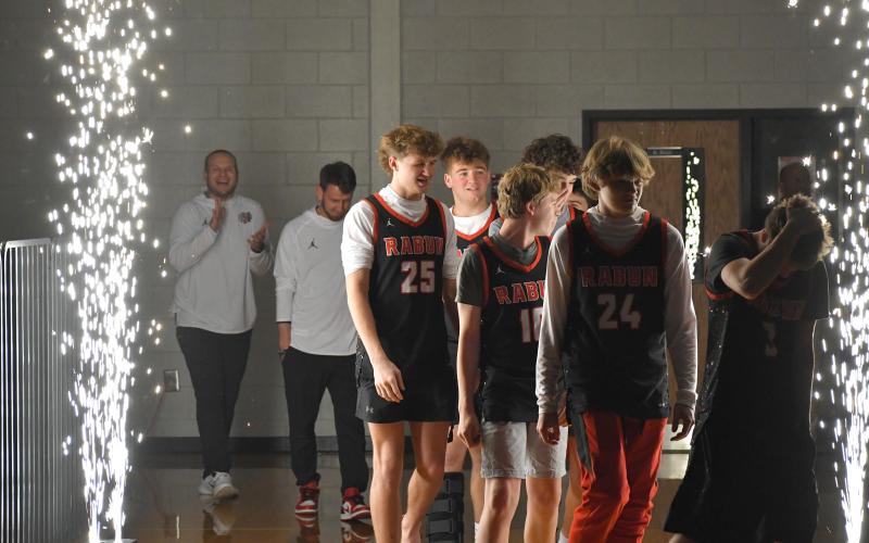 Wesley Branch/The Clayton Tribune. The Rabun County High School basketball team walks onto the floor for its championship celebration on RCHS’ campus on March 26.