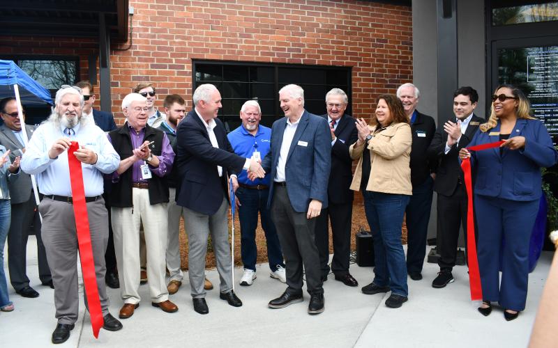 Megan Horn/The Clayton Tribune. The Rabun County community came together on March 26 to celebrate the grand opening of the MedLink Georgia Rabun Health Campus. In the center, Rick Story, Forward Rabun president and director of development for Rabun County, shakes hands with MedLink Georgia CEO Dave Ward. The 31,000-plus square-foot facility is located at 811 Highway 441 in Clayton.