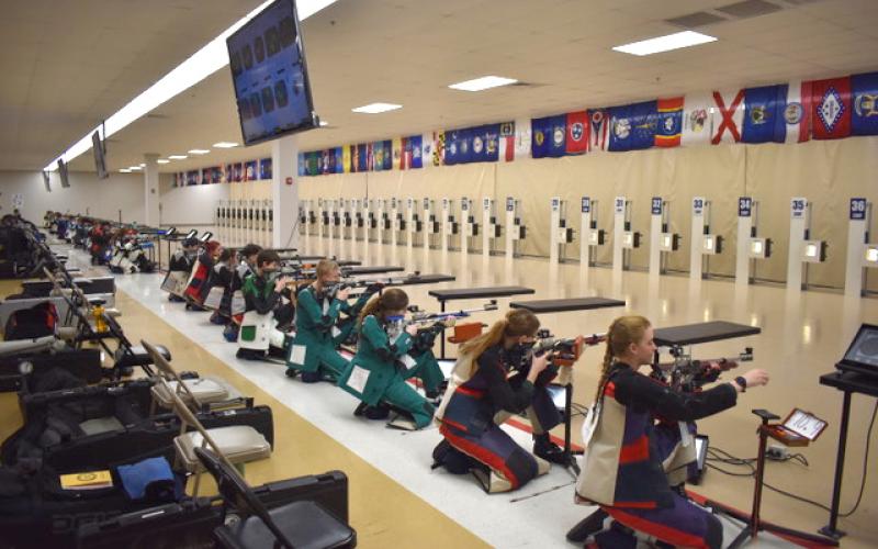 Submitted photo. Rifle team members including Tallulah Falls (center) take aim at in the regional championship in Alabama.