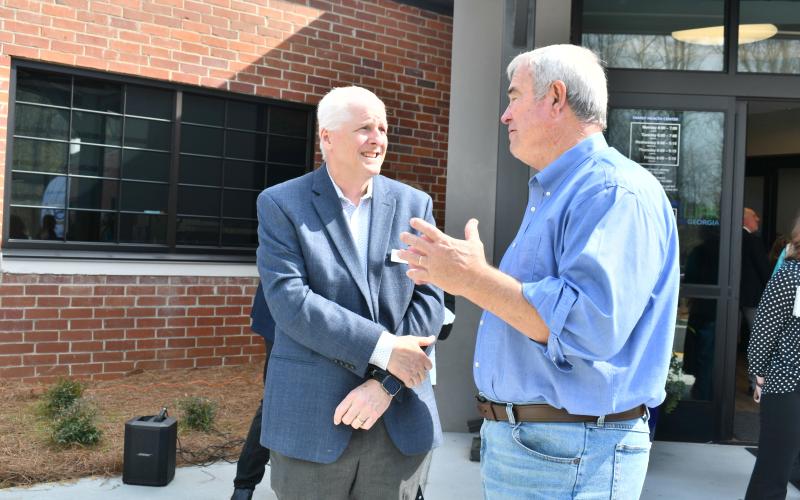 Megan Horn/The Clayton Tribune. Rabun County Commissioner Kent Woerner, right, converses with MedLink Georgia CEO Dave Ward at the March 26 ribbon cutting and grand opening of the Rabun Health Campus located at 811 Highway 441 in Clayton.