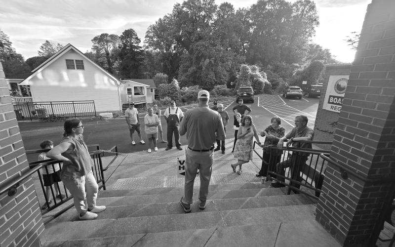 Enoch Autry/The Clayton Tribune. Candidates for Rabun County commission and magistrate judge listen to John Bradshaw announce some of the election numbers on Tuesday evening.