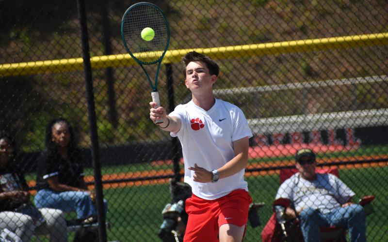 Wesley Branch/The Clayton Tribune. : Rabun County’s Andrew Conner strikes the ball during his doubles match with teammate Braylon Kelly versus Swainsboro in the Elite Eight at Rabun County High School on May 4. Conner and Kelly were victorious on No. 2 doubles, 6-1, 6-1.