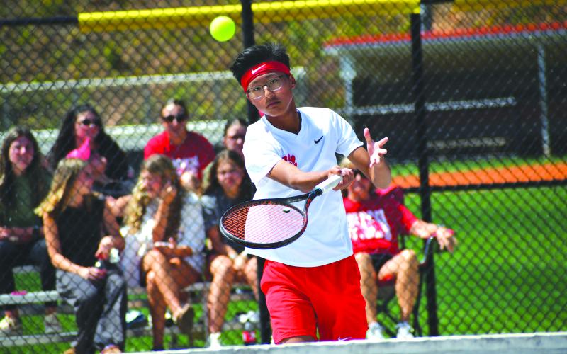 Wesley Branch/The Clayton Tribune. Rabun County freshman Jack Getty returns the ball during his singles match versus Swainsboro in the state playoffs on May 4 at Rabun County High School. Getty, the son of RCHS boys tennis head coach Bryan Getty, was victorious 6-0, 6-0.