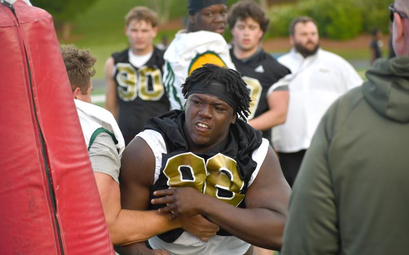 Wesley Branch/The Clayton Tribune. Rabun Gap rising junior defensive lineman Segun Alexander fights through a block during the one-on-one portion of Rabun Gap’s college coaches social on May 7 at Rabun Gap-Nacoochee School. Alexander has over 20 Division I scholarship offers.