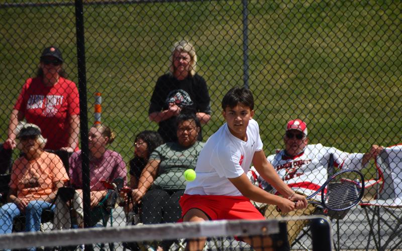 Wesley Branch/The Clayton Tribune. Rabun County junior Braylon Kelly eyes the ball during his doubles match with Andrew Conner versus Model on May 8 at RCHS. Kelly and Conner were victorious, 6-3, 6-1.