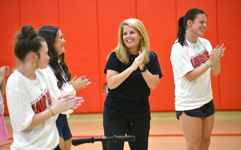 Wesley Branch/The Clayton Tribune. Rabun County head girls basketball coach DeeDee Dillard dances to the “cha cha slide” to kick off the Rabun County Lady Cats basketball camp on May 11. Each day of camp opened with a group dance.