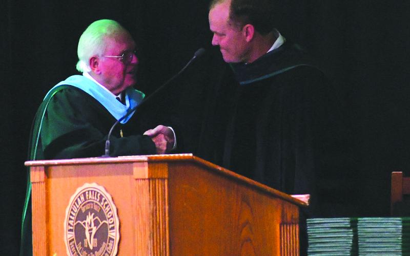 Enoch Autry/The Clayton Tribune.  Tallulah Falls School President and Head of School Dr. Larry Peevy shakes the hand of commencement speaker Georgia Court of Appeals Judge Brian Rickman, a board of trustees member whose daughter Molly was among the Class of 2026.