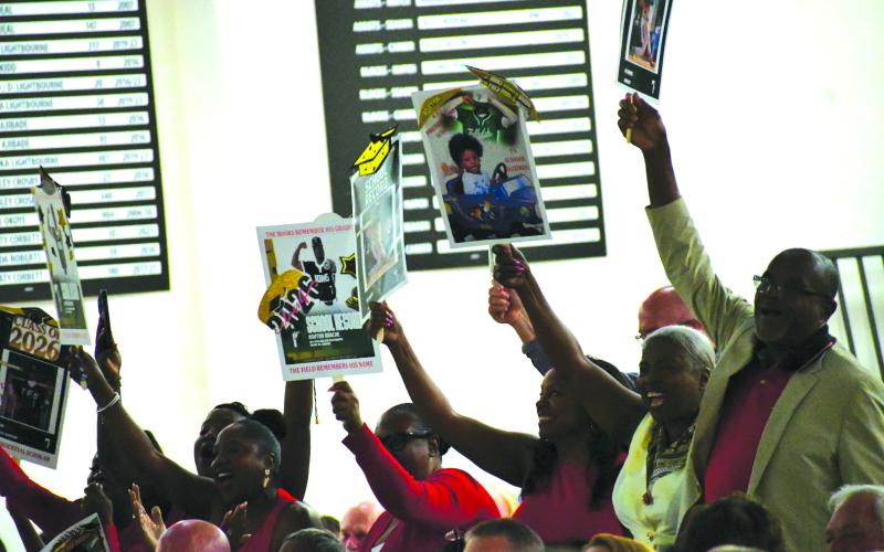 Enoch Autry/The Clayton Tribune. The family of Neyo Bain celebrate a graduate from Jamaica as he walks across the stage in the Activity Center on May 22.