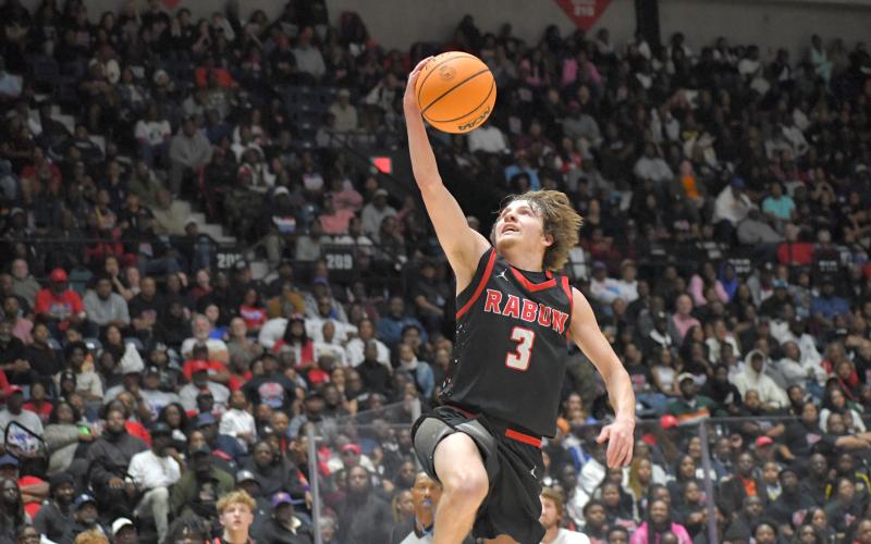 Wesley Branch/The Clayton Tribune. Rabun County senior Huey Blalock skies for a layup in Rabun County’s 52-43 state championship victory over Southwest on March 13. Blalock scored 29 points and earned MVP honors in the win. On April 22, he was named MaxPreps “Small Town All-Americans” third-team.