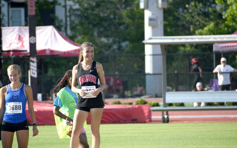 Wesley Branch/The Clayton Tribune. Rabun County freshman Kinley Jones smiles after receiving her medal for finishing seventh place in the 3200 meter race at the GHSA state championship meet on May 12 in Athens.