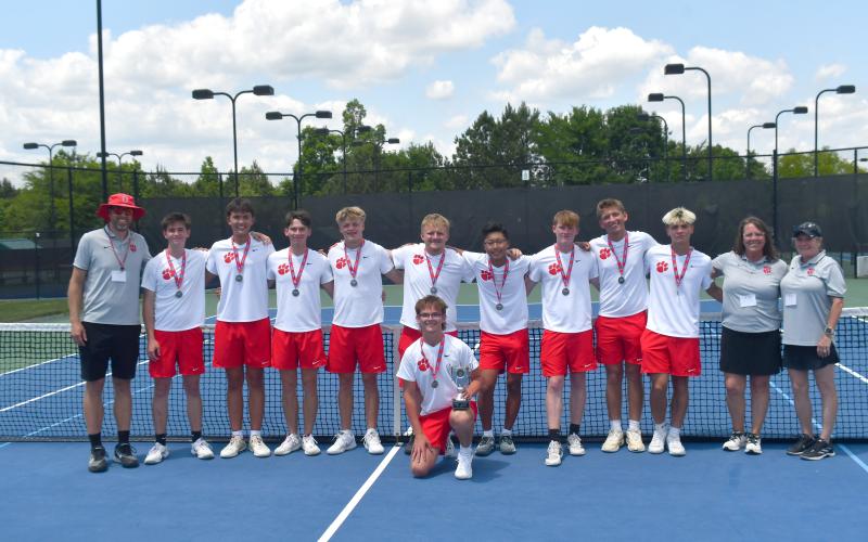Wesley Branch/The Clayton Tribune. The Rabun County boys tennis team and coaches pose with the state runner-up trophy after their state championship match versus Brantley County on May 13 at the Rome Tennis Center. The Wildcats earned state runner-up honors for the first time in program history.