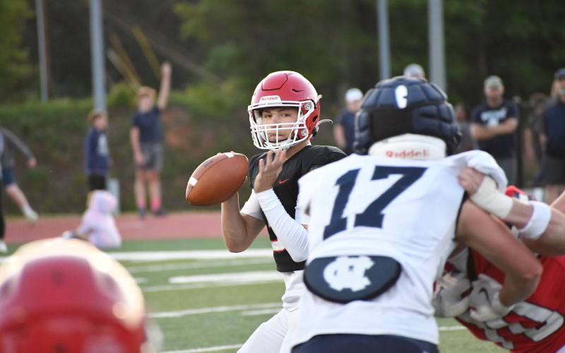 Wesley Branch/The Clayton Tribune.  Rabun County freshman quarterback Cooper Kowalsky surveys the field during Rabun County’s spring game versus White County. Kowalsky is slated to be the starting QB for the Wildcats in 2026 after backing up Ty Truelove in 2025.