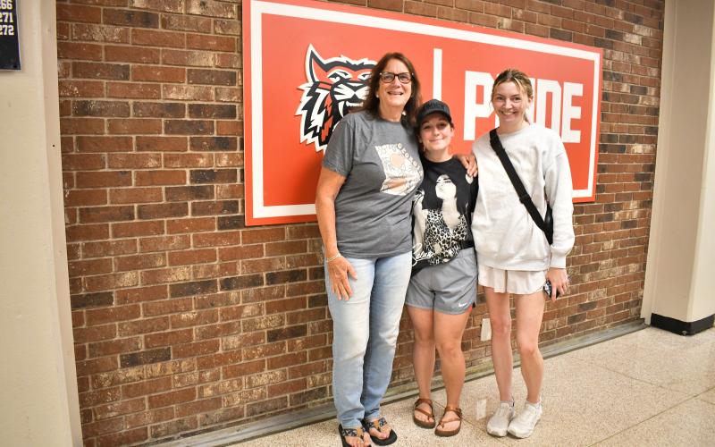 Megan Horn/The Clayton Tribune. Angela Luke, who retired from Rabun County Schools in 2016; Ashley Weeks, Class of 2013; and Sarah Arace, Class of 2013, have fond memories in the hallways of RCHS during the May 16 walkthrough.