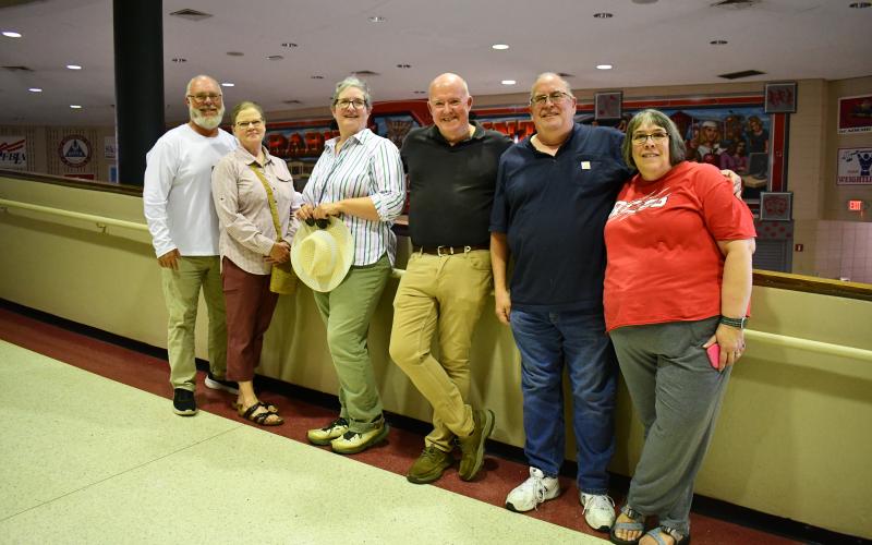 Megan Horn/The Clayton Tribune. Mark Beck, BOE member and Class of 1979; Mary Ann Martin Littrell, Class of 1980; Dana Burrell, Class of 1980; John Singleton, Class of 1980; Danny Flory, Class of 1984; and Becky Flory, Class of 1983, reminisce as they walk the hallways of Rabun County High School one final time on May 16.