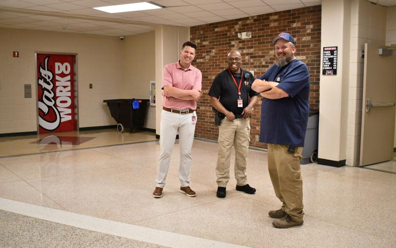 Megan Horn/The Clayton Tribune. Mr. Spillers, Shane Taylor and Rabun County High School School Resource Officer Lindsey Owens walk through the halls of the current high school building one last time on May 16.