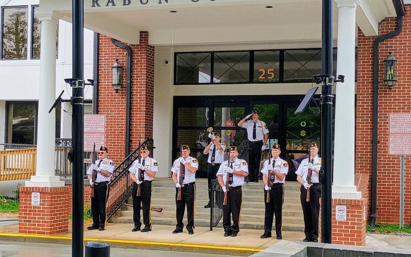 Megan Horn/The Clayton Tribune.  The Honor Guard performs the three-volley salute and “Taps” during a Memorial Day event honoring veterans at the Veterans Memorial in front of the Rabun County Courthouse. The Honor Guard consists of veterans from D.A.V Ch. 15; American Legion Post 220; American Legion Post 84; VFW Post 4570 and VFW Post 7720.