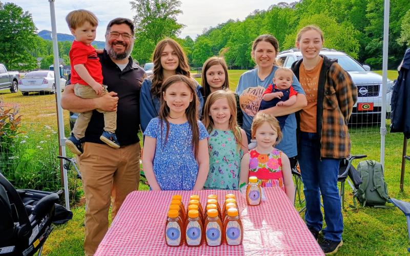 Meagn Horn/The Clayton Tribune. Bridge Creek Honey sell their food during the OSG Spring Plant Sale last weekend. Pictured are Bobby, Mindi, Katie, 17, Cali, 13, Kinley, 11, Caroline, 9, Kensie, 6, Clara, 4, Kaleb, 2, and Callum, 5-months-old.