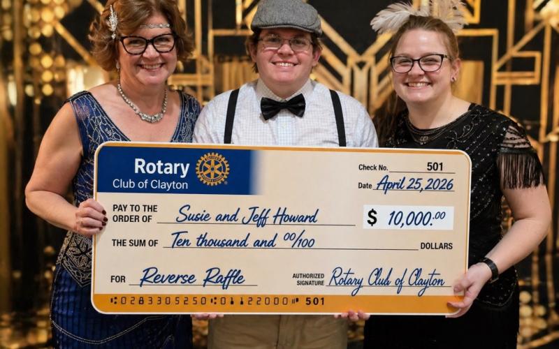 Submitted photo. Jeff and Susie Howard were the winners of the $10,000 Grand Prize Reverse Raffle at the April 25 Rotary Club of Clayton’s Roaring 20s Murder Mystery Gala event. Pictured are Howard with son Nicholas Howard and daughter Kayla Howard.